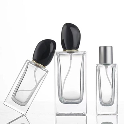 Garrafa de perfume de vidro quadrado com 50 ml de 100 ml de capacidade e tampa de forma irregular